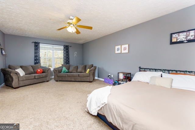 carpeted bedroom with ceiling fan and a textured ceiling