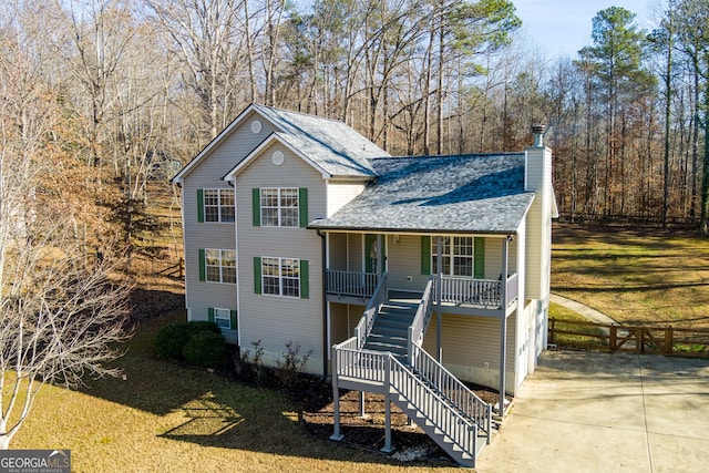 view of front property featuring a front lawn and a porch