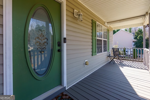 doorway to property featuring a porch