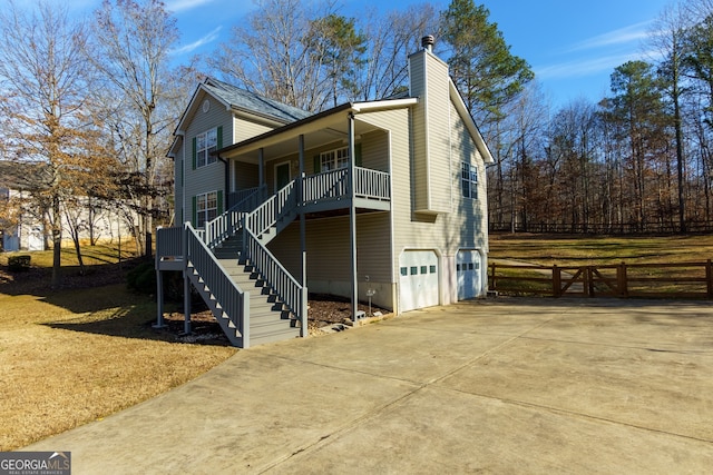 view of front facade featuring covered porch and a garage