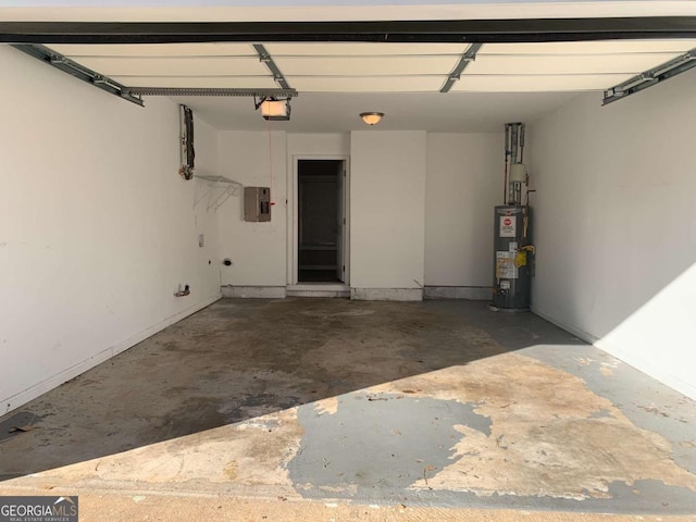 garage with electric panel, a garage door opener, and water heater