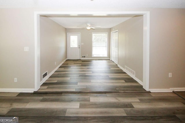 foyer entrance featuring dark hardwood / wood-style floors and ceiling fan