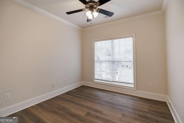 empty room featuring crown molding, ceiling fan, and dark hardwood / wood-style floors