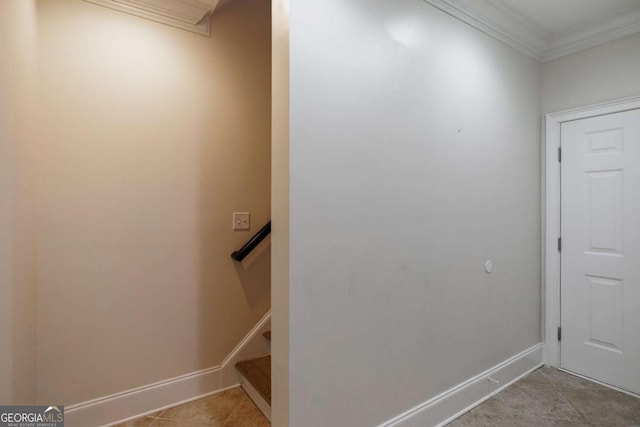 interior space with crown molding and tile patterned flooring