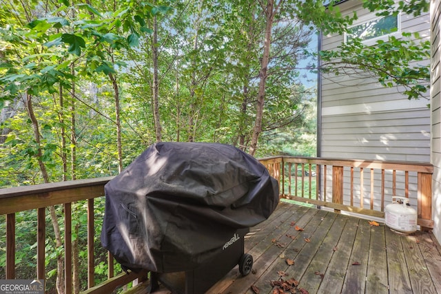 wooden deck featuring area for grilling