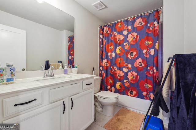 full bathroom with tile patterned floors, vanity, toilet, and shower / bath combo