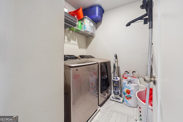 laundry area with washing machine and clothes dryer