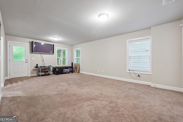 unfurnished living room with carpet floors