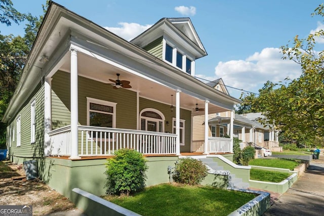 view of front of property featuring ceiling fan and a porch