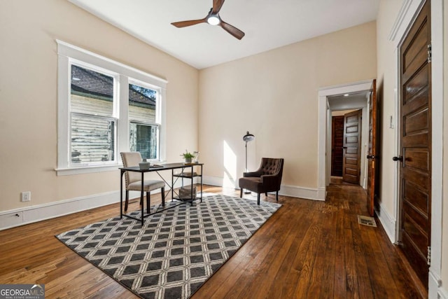 office with dark hardwood / wood-style floors and ceiling fan