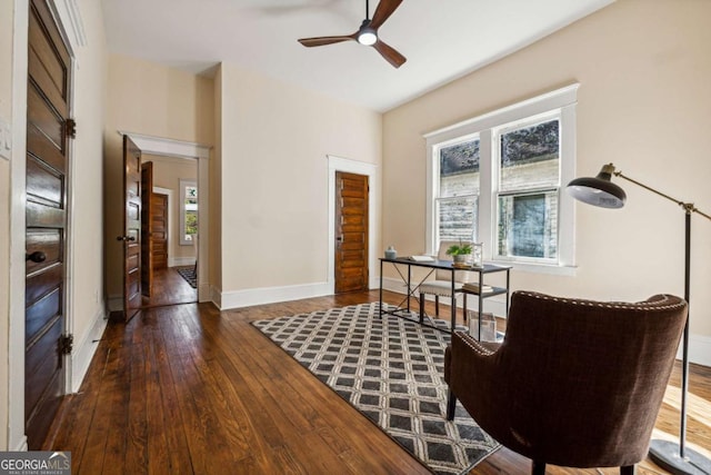 sitting room featuring dark hardwood / wood-style flooring and ceiling fan