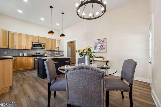 dining area featuring a chandelier and hardwood / wood-style flooring