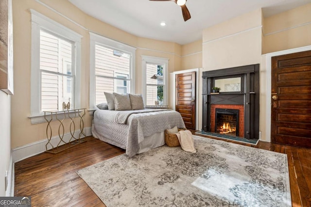 bedroom featuring hardwood / wood-style flooring and ceiling fan