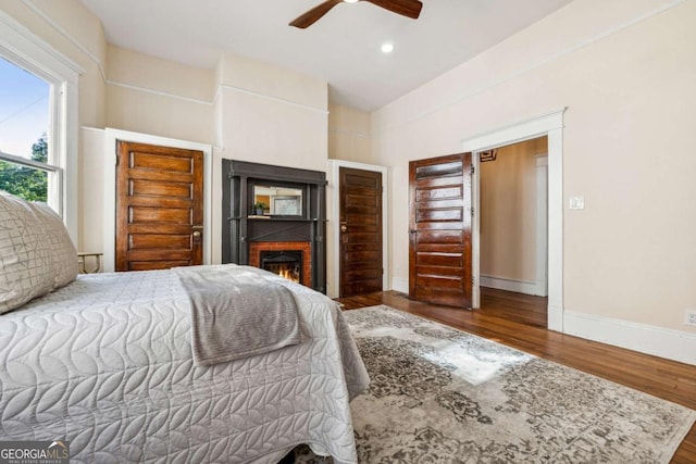 bedroom with hardwood / wood-style flooring and ceiling fan