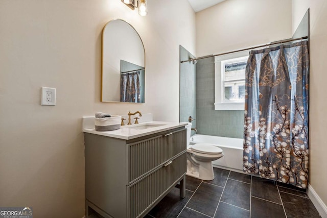 full bathroom with shower / tub combo with curtain, vanity, and toilet