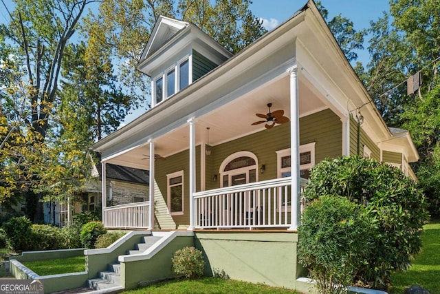 view of front of home featuring ceiling fan and covered porch