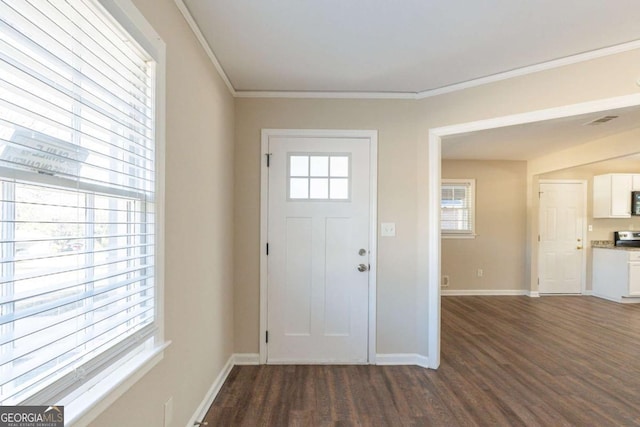 entrance foyer with crown molding and dark hardwood / wood-style flooring