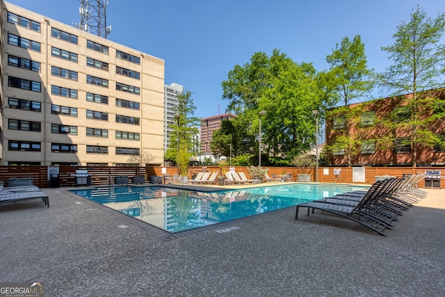 view of swimming pool featuring a patio