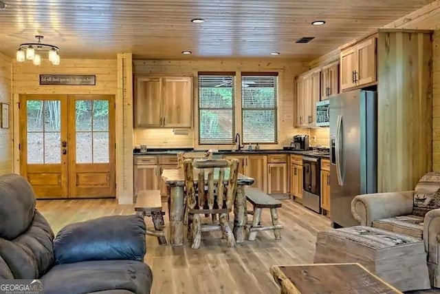 kitchen featuring light hardwood / wood-style floors, sink, appliances with stainless steel finishes, and french doors