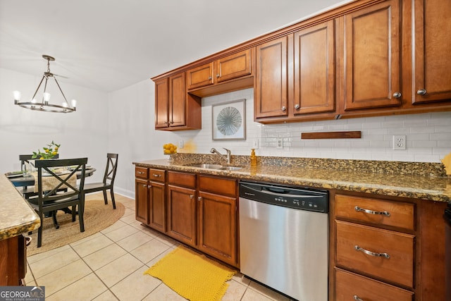 kitchen with sink, dishwasher, an inviting chandelier, pendant lighting, and light tile patterned floors