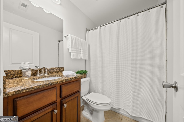 bathroom with tile patterned flooring, vanity, curtained shower, and toilet