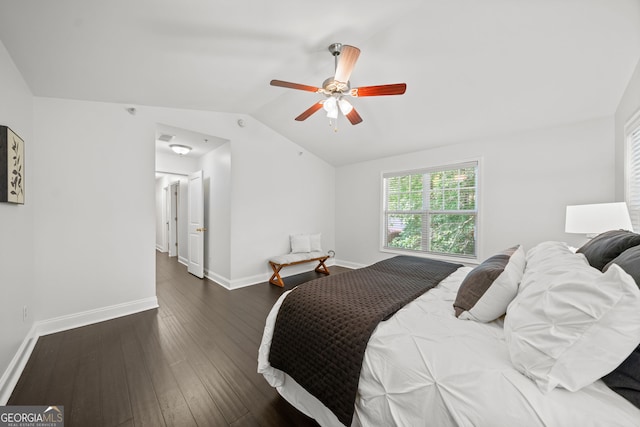 bedroom with dark wood-type flooring, ceiling fan, and lofted ceiling