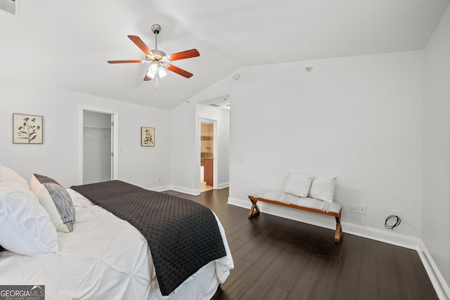 bedroom with lofted ceiling, dark wood-type flooring, ceiling fan, a spacious closet, and a closet