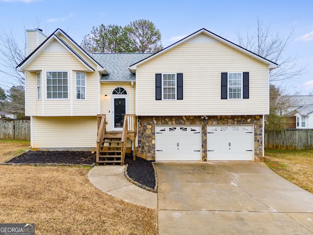 raised ranch featuring a garage