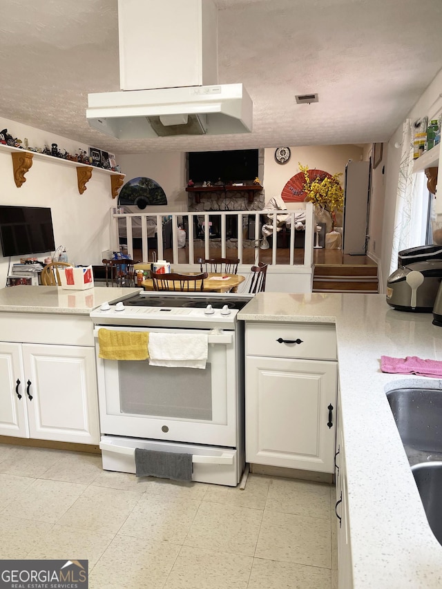 kitchen with white cabinetry, sink, light stone counters, and white range