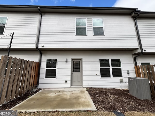 back of house with a patio and central air condition unit