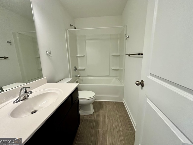 full bathroom featuring bathing tub / shower combination, vanity, and toilet