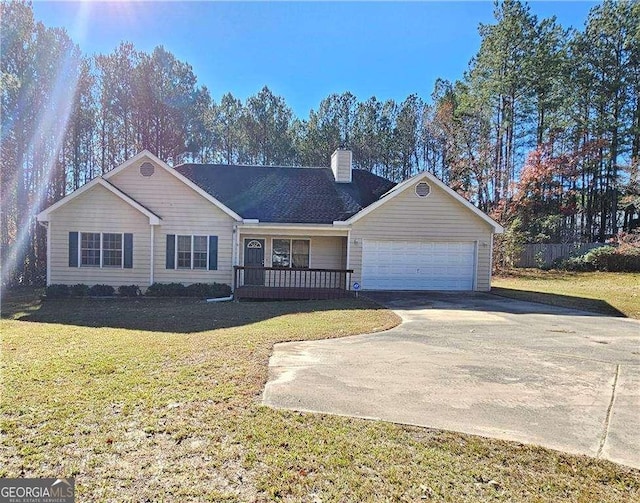 ranch-style house featuring a front lawn and a garage