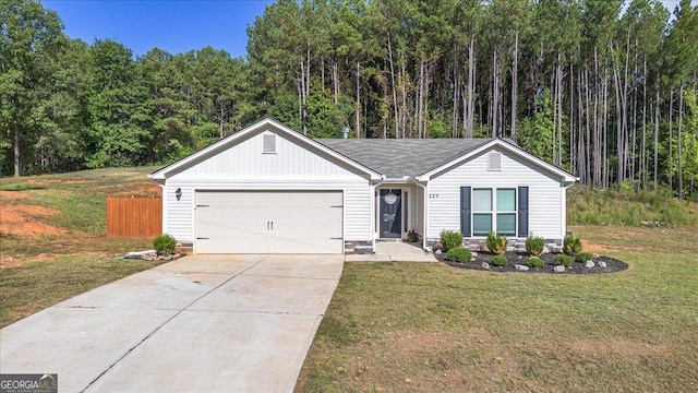 ranch-style home featuring a front lawn and a garage