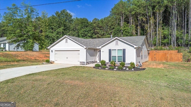 view of front facade with a garage and a front lawn