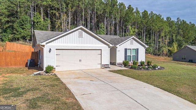 single story home featuring cooling unit, a garage, and a front lawn