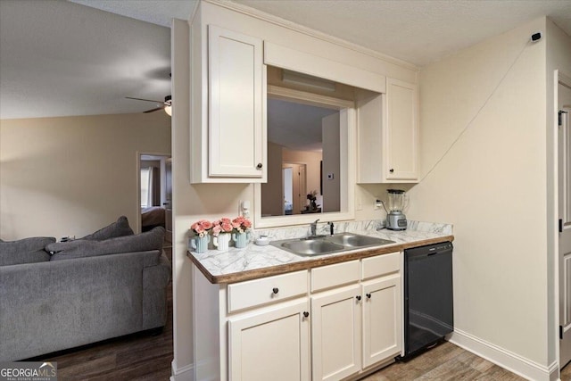 kitchen with white cabinets, dark hardwood / wood-style flooring, black dishwasher, and sink