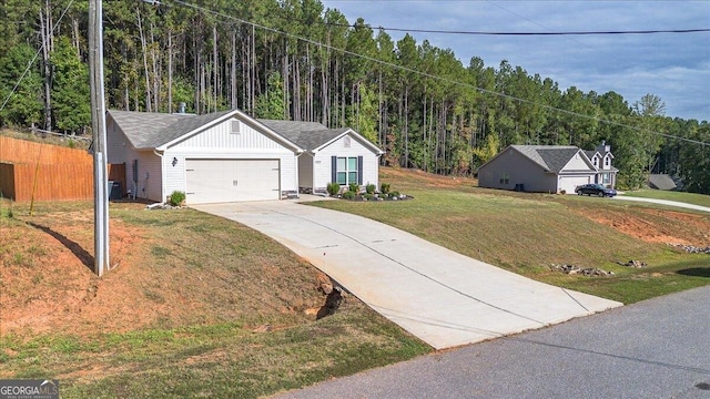 view of front facade featuring a front yard and a garage