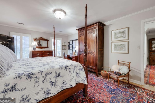 bedroom with multiple windows and ornamental molding