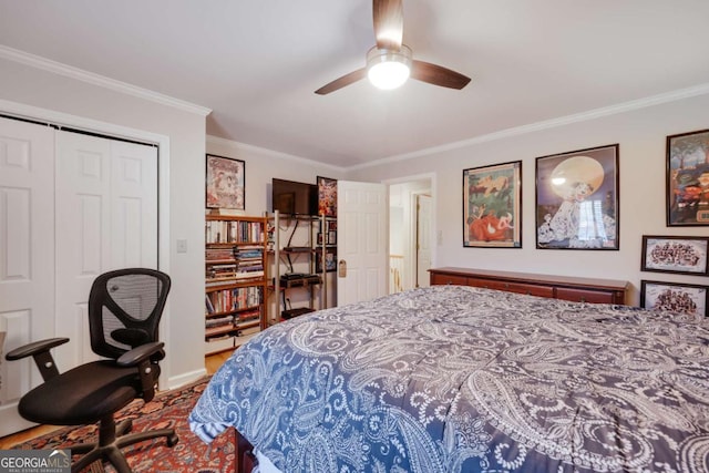 bedroom featuring a closet, ceiling fan, and ornamental molding