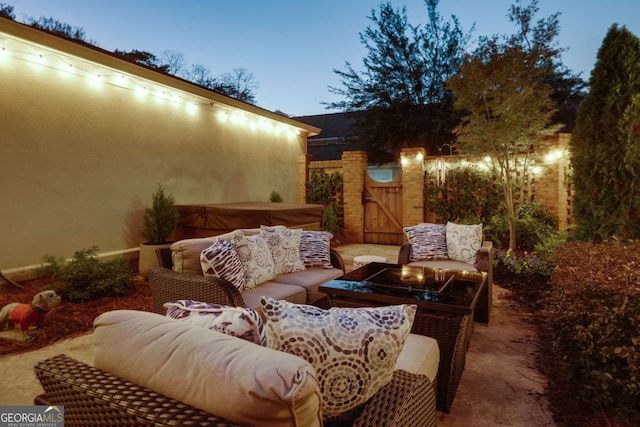 view of patio terrace at dusk