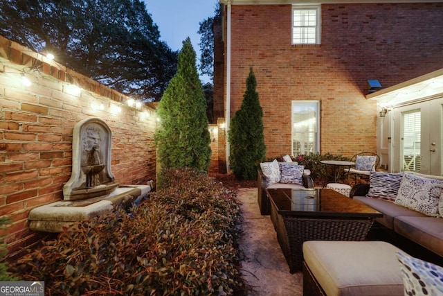 view of home's exterior with an outdoor hangout area and a patio