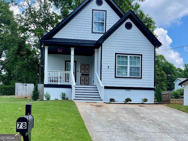 view of front of house featuring a porch and a front lawn