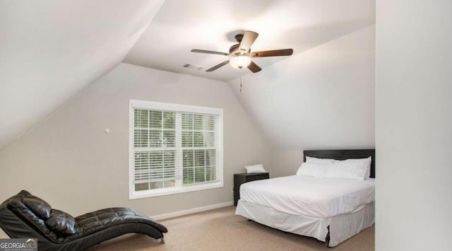 bedroom featuring ceiling fan, carpet floors, and vaulted ceiling