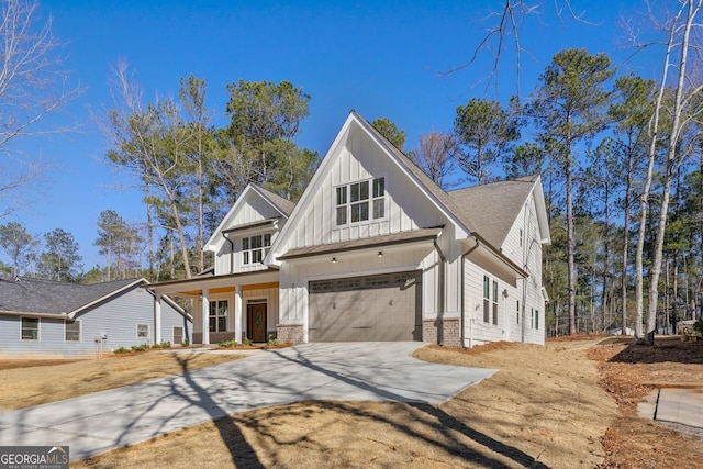 modern inspired farmhouse with a garage and covered porch