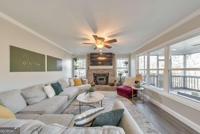 living room with ceiling fan, crown molding, and hardwood / wood-style floors