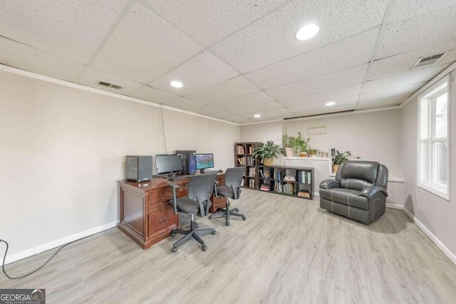 office area featuring hardwood / wood-style floors and a drop ceiling