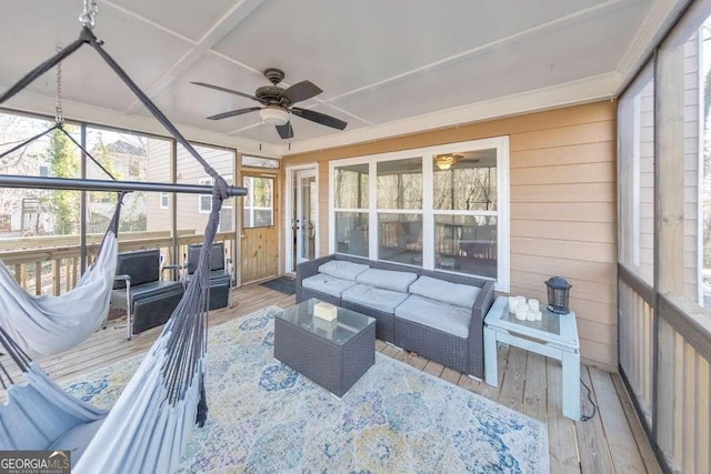 sunroom / solarium featuring ceiling fan and coffered ceiling