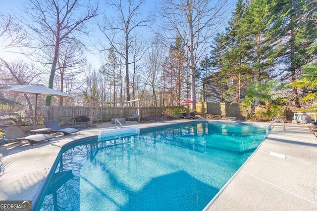 view of swimming pool featuring a patio area