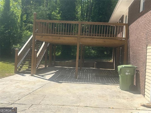 view of gate featuring a wooden deck