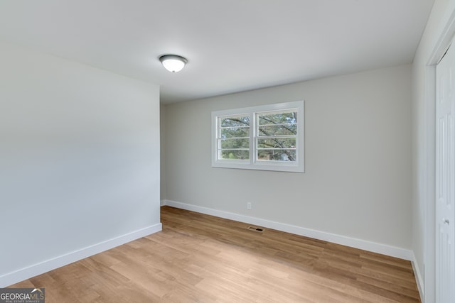 empty room with light wood-type flooring